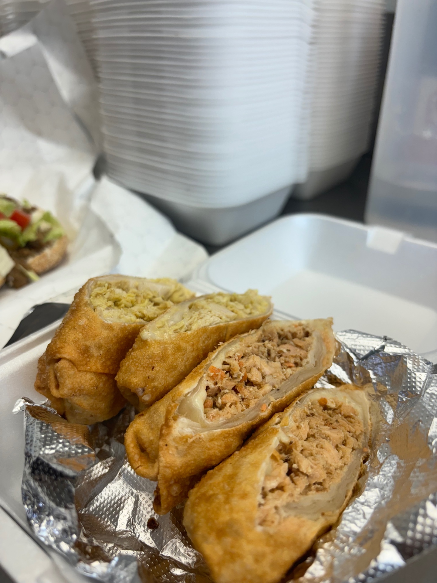 Salmon, chicken and steak egg rolls sliced open